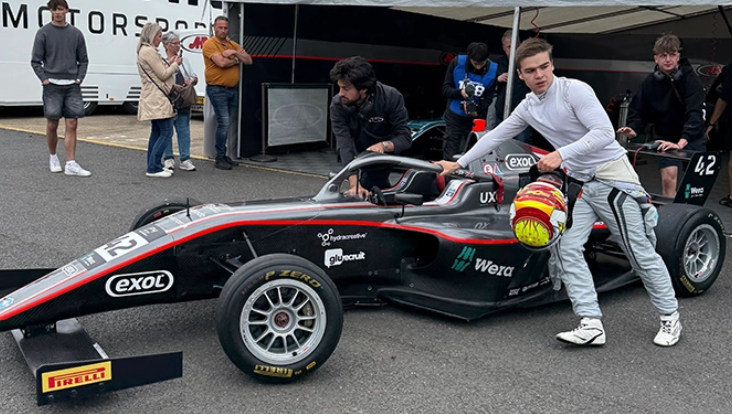 Rowan and his team pushing his car out of the team's pits.